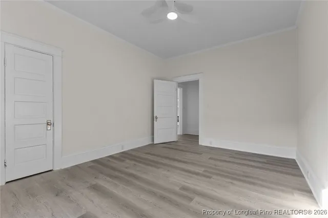 a bathroom with a toilet sink vanity and mirror