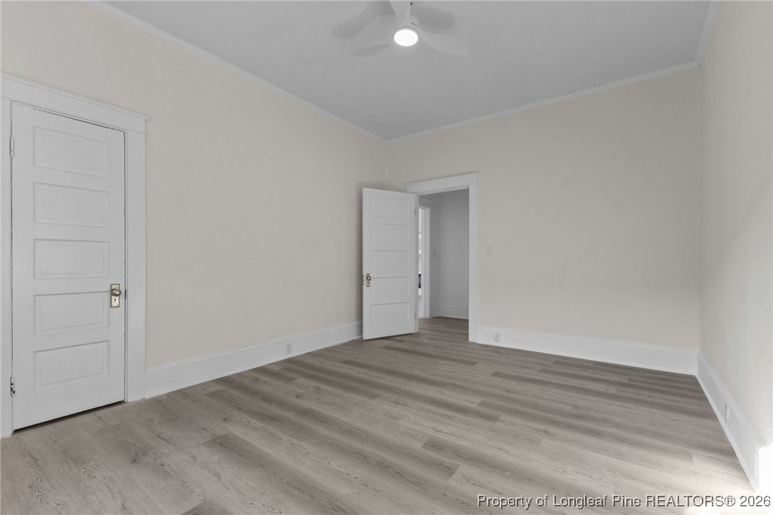 220 Beaman Street Clinton, NC 28328 - Photo 21 of 32 a view of an empty room and wooden floor
