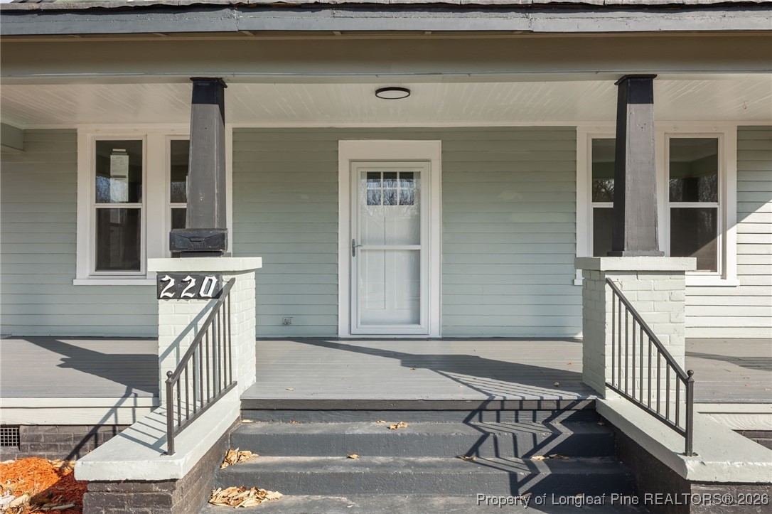 220 Beaman Street Clinton, NC 28328 - Photo 3 of 32 a view of a brick house with large windows