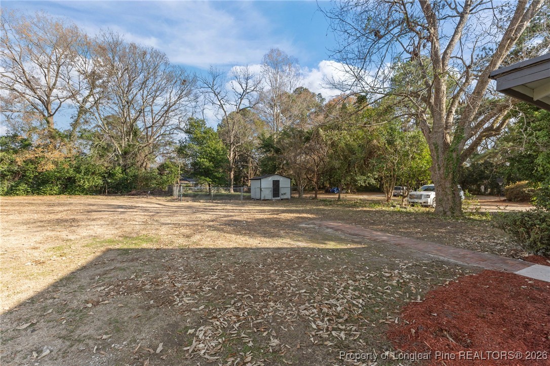 220 Beaman Street Clinton, NC 28328 - Photo 31 of 32 a view of road with large trees