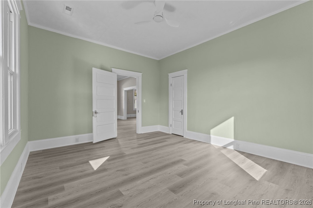 220 Beaman Street Clinton, NC 28328 - Photo 7 of 32 a view of empty room with wooden floor