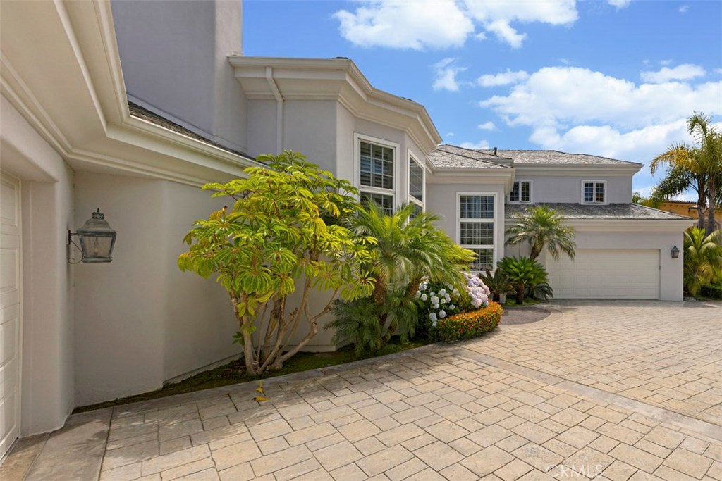 97 Ritz Cove Drive Dana Point, CA 92629 - Photo 2 of 43 a front view of a house with garden