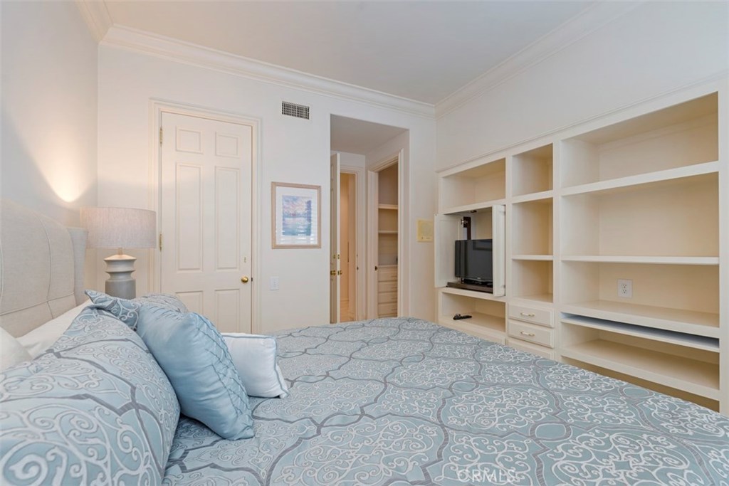 97 Ritz Cove Drive Dana Point, CA 92629 - Photo 21 of 43 a bedroom with a bed and a television