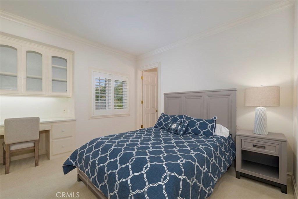 97 Ritz Cove Drive Dana Point, CA 92629 - Photo 27 of 43 a bedroom with a large bed and a chair