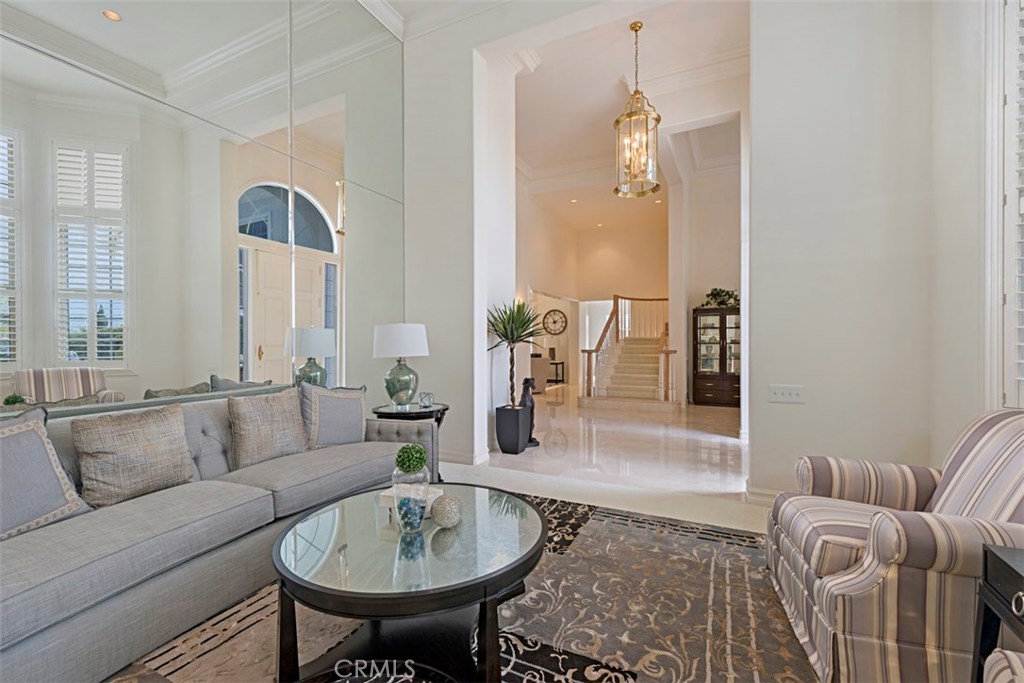 97 Ritz Cove Drive Dana Point, CA 92629 - Photo 8 of 43 a living room with furniture and a chandelier