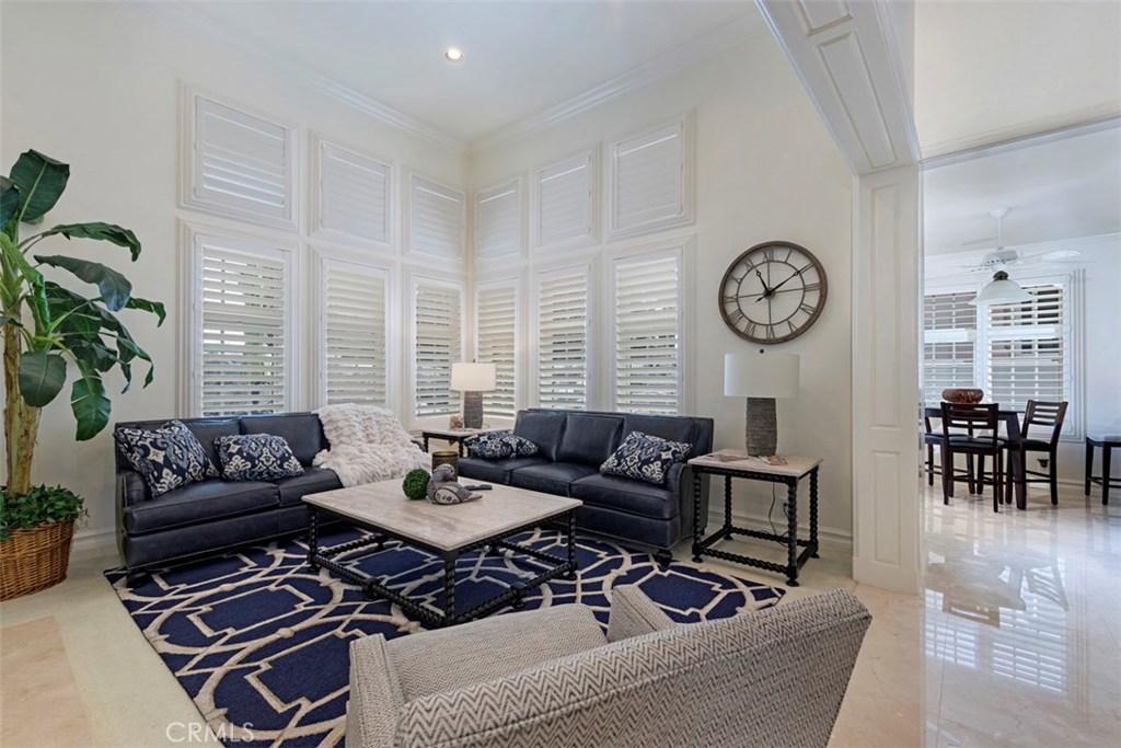 97 Ritz Cove Drive Dana Point, CA 92629 - Photo 9 of 43 a living room with furniture a clock and a window