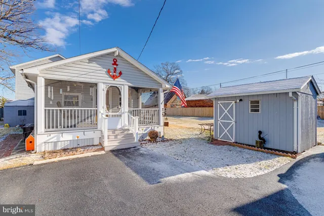 a view of a house with wooden fence