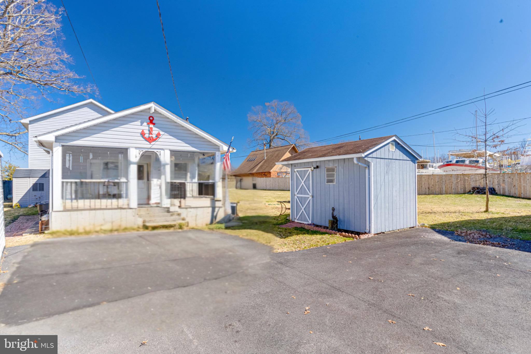 a front view of a house with a yard and a porch