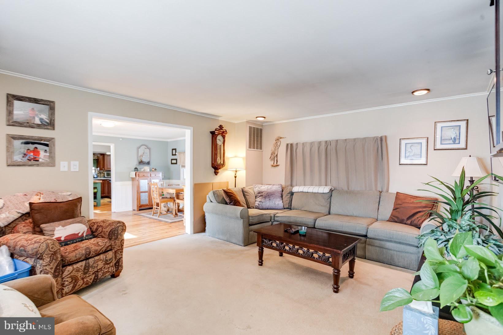 215 Nanticoke Road Essex, MD 21221 - Photo 11 of 28 Inviting living space with warm ambiance.