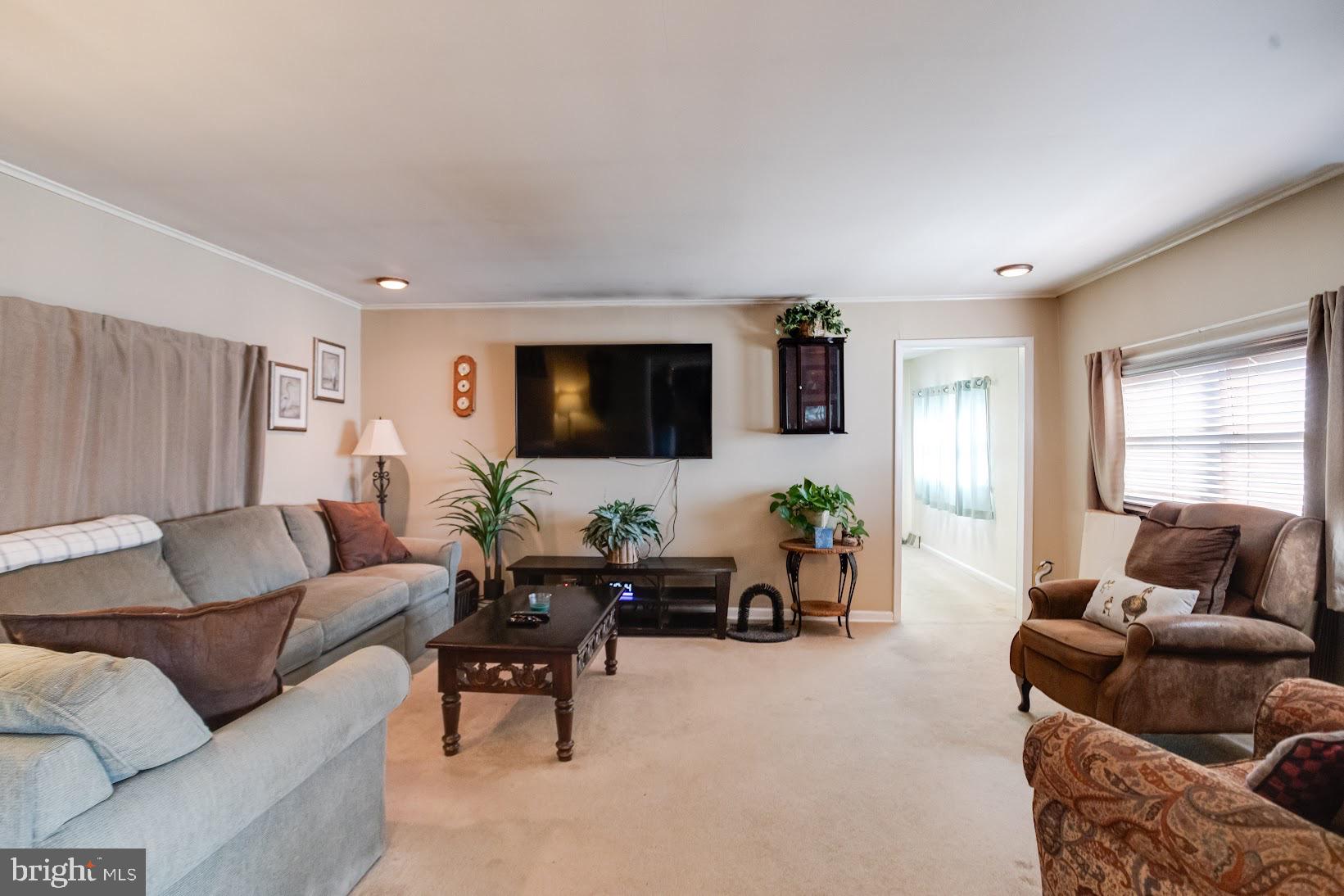 215 Nanticoke Road Essex, MD 21221 - Photo 13 of 28 Cozy living space with natural light.