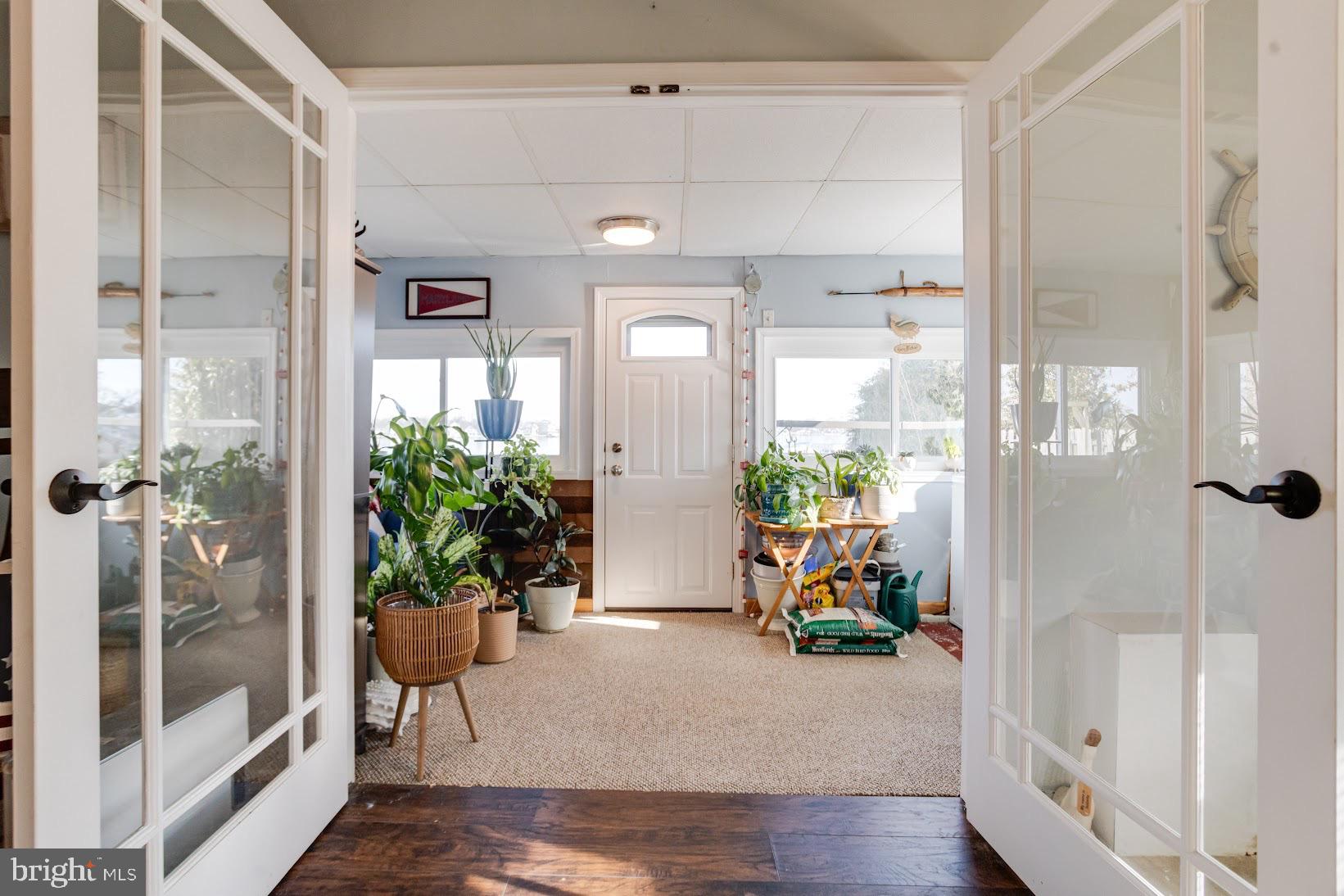 215 Nanticoke Road Essex, MD 21221 - Photo 15 of 28 Inviting entryway filled with greenery.