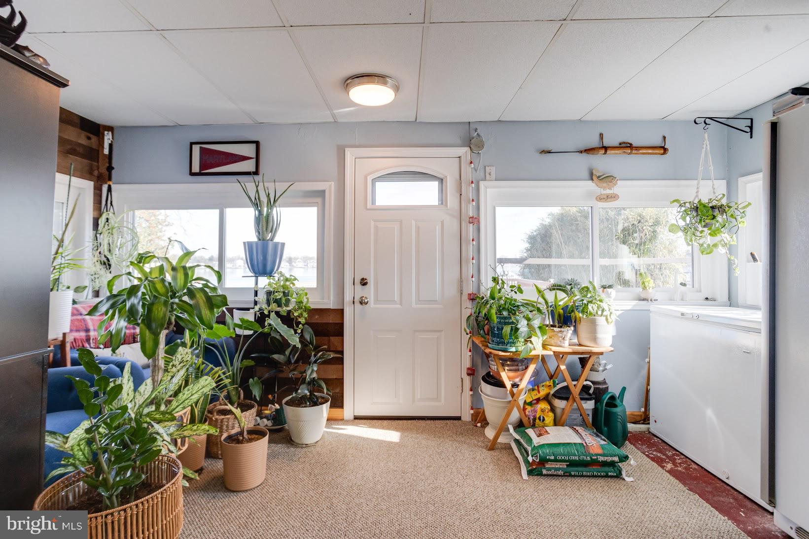 215 Nanticoke Road Essex, MD 21221 - Photo 16 of 28 Lush greenery brightens a cozy sunlit space.
