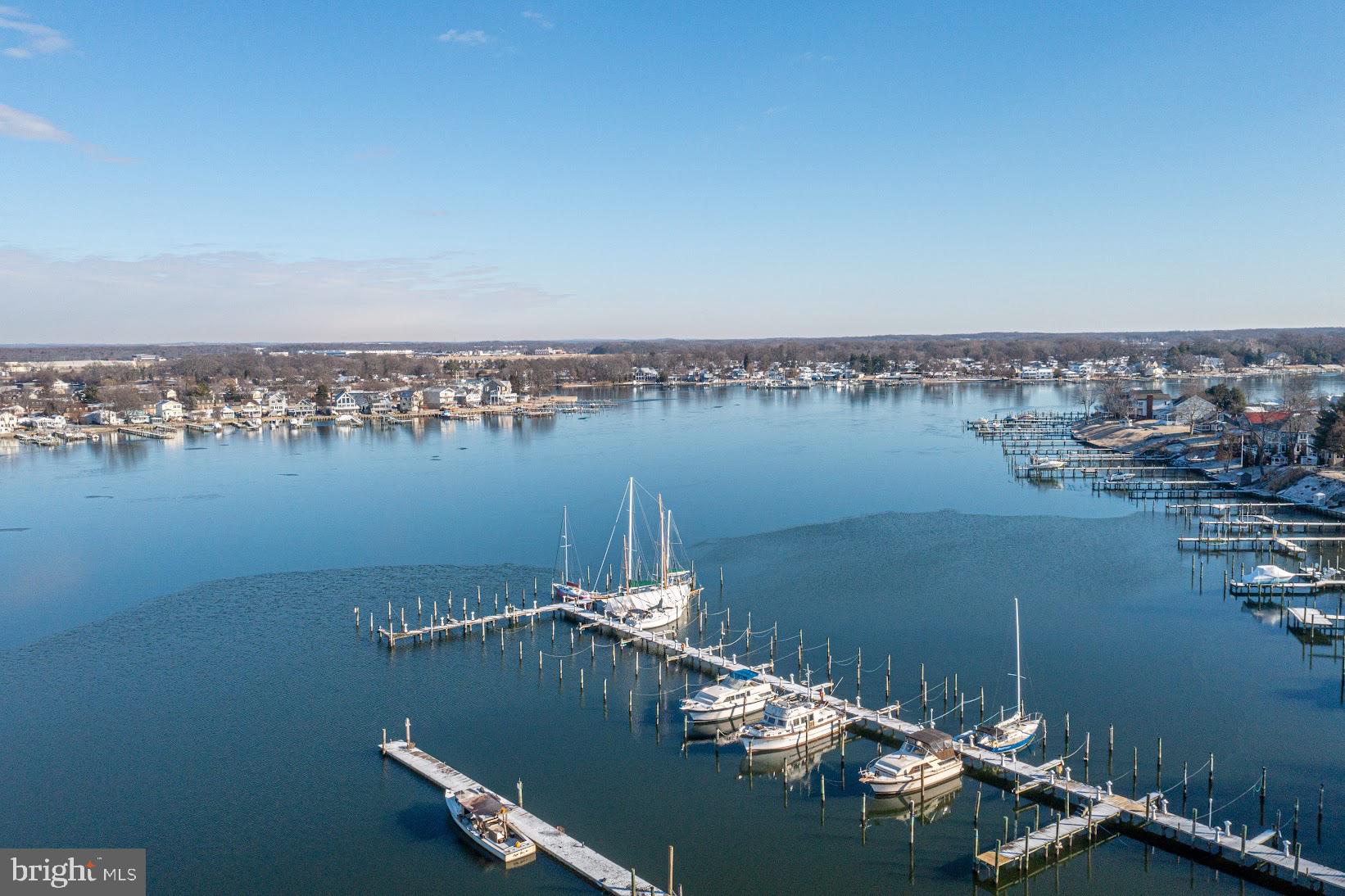 215 Nanticoke Road Essex, MD 21221 - Photo 21 of 28 Serene waterfront with boats at dock.