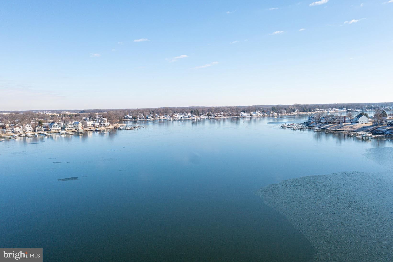 215 Nanticoke Road Essex, MD 21221 - Photo 25 of 28 Serene waters reflecting a clear sky.