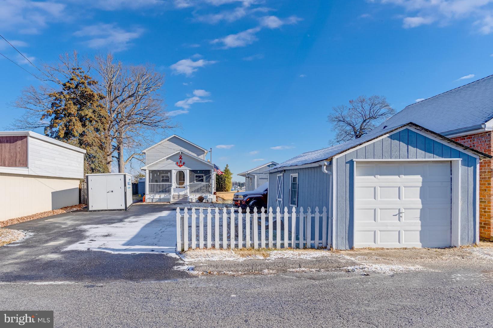 215 Nanticoke Road Essex, MD 21221 - Photo 4 of 28 Charming home with a snowy driveway.