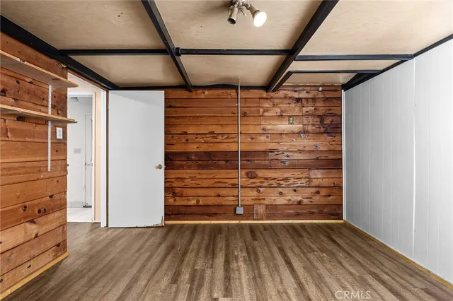 a bathroom with a granite countertop sink toilet a mirror and a shower
