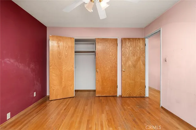 a backyard of a house with chairs and a fire pit