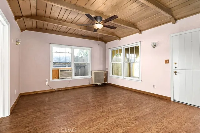 a view of a house with a backyard and sitting area