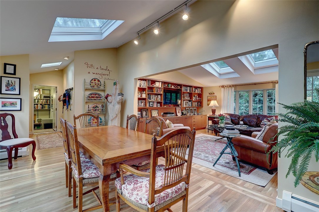 39 Major Potter Road Warwick, RI 02886 - Photo 13 of 32 dining room, showing the skylights, hardwood floors, hallway to office, and family room