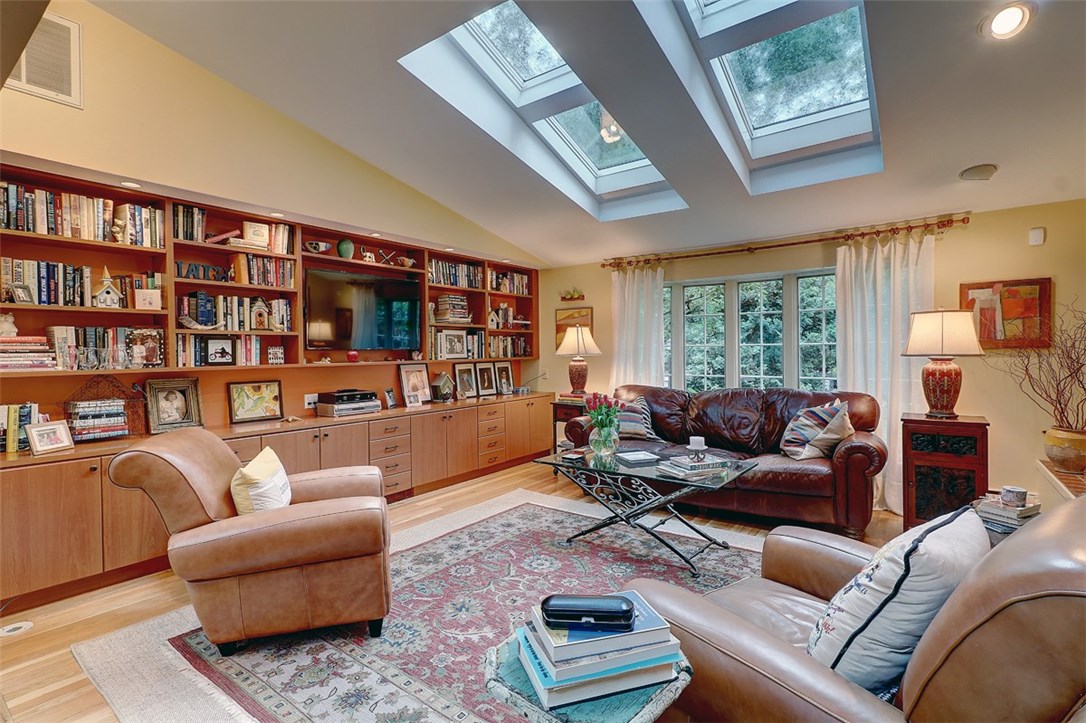 39 Major Potter Road Warwick, RI 02886 - Photo 9 of 32 family room, built in book cases, hardwood floors, oversized windows, skylights