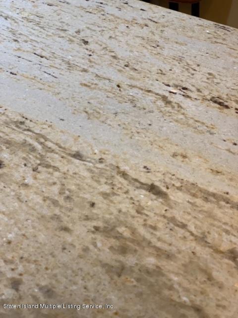 26 Tides Lane Staten Island, NY 10309 - Photo 12 of 41 a view of a dry yard with wooden floor