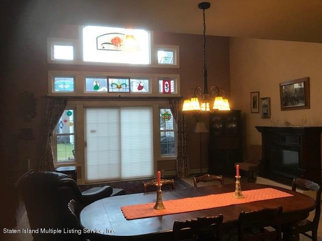 26 Tides Lane Staten Island, NY 10309 - Photo 14 of 41 a bathroom with a sink and a mirror