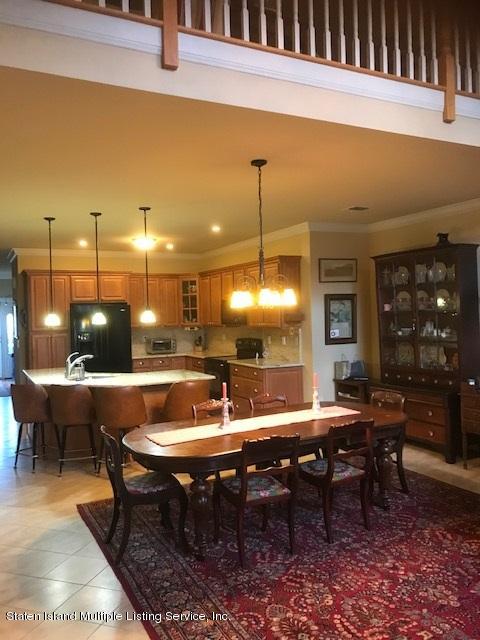 26 Tides Lane Staten Island, NY 10309 - Photo 15 of 41 a view of a tables and chairs in patio