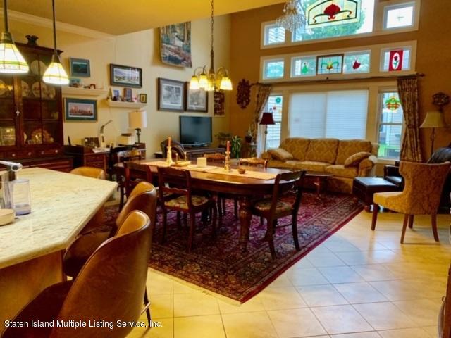 26 Tides Lane Staten Island, NY 10309 - Photo 18 of 41 a view of a dining room with furniture