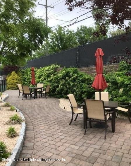 26 Tides Lane Staten Island, NY 10309 - Photo 29 of 41 a view of a chairs and table in backyard