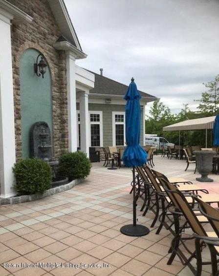 26 Tides Lane Staten Island, NY 10309 - Photo 33 of 41 a view of a house with backyard porch and patio
