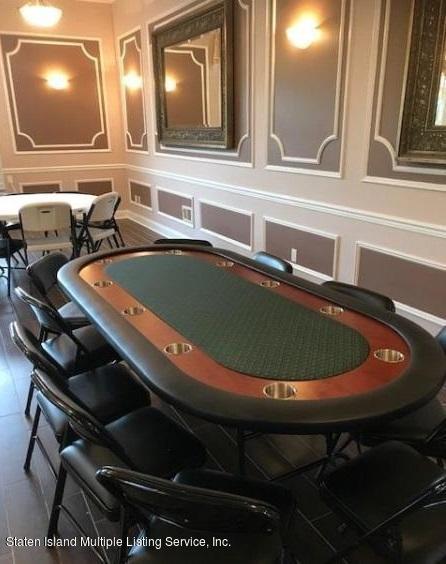 26 Tides Lane Staten Island, NY 10309 - Photo 39 of 41 a table with chairs and fan