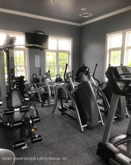 26 Tides Lane Staten Island, NY 10309 - Photo 41 of 41 a room with gym equipment and windows
