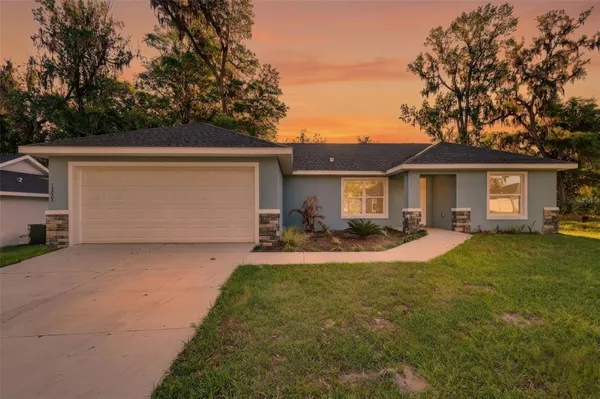 front view of a house with a yard