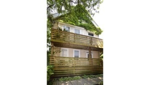 a view of a house with a tree