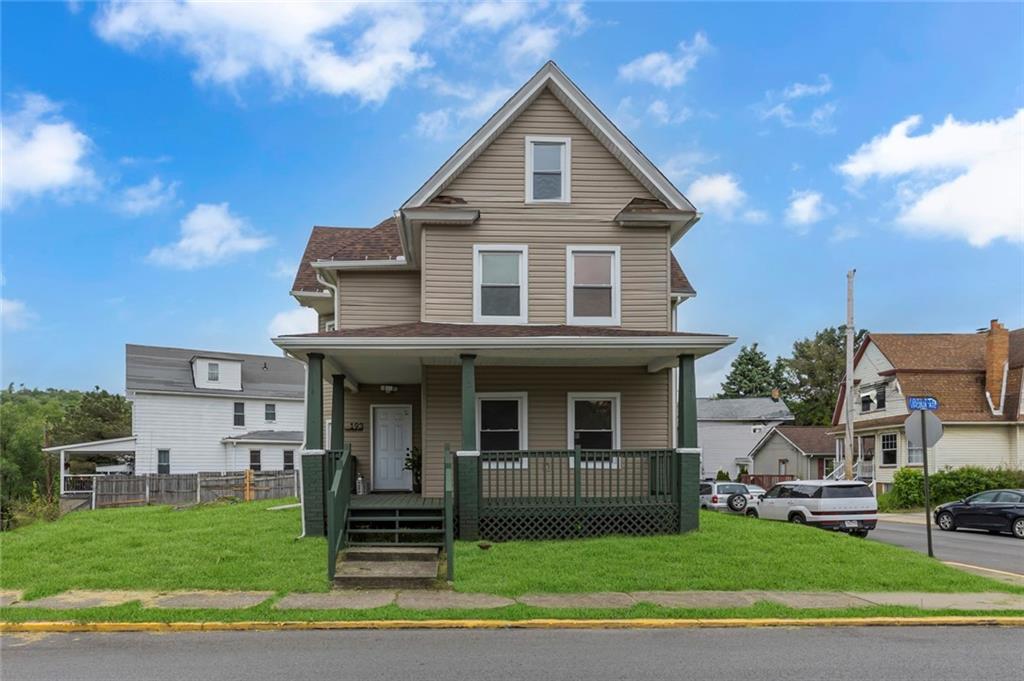 a front view of a house with a yard