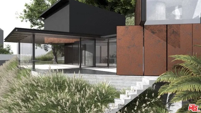 a backyard of a house with table and chairs