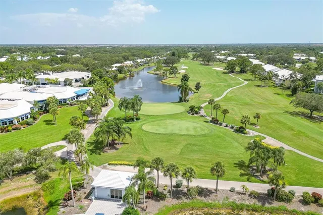 a view of a golf course with a lake view