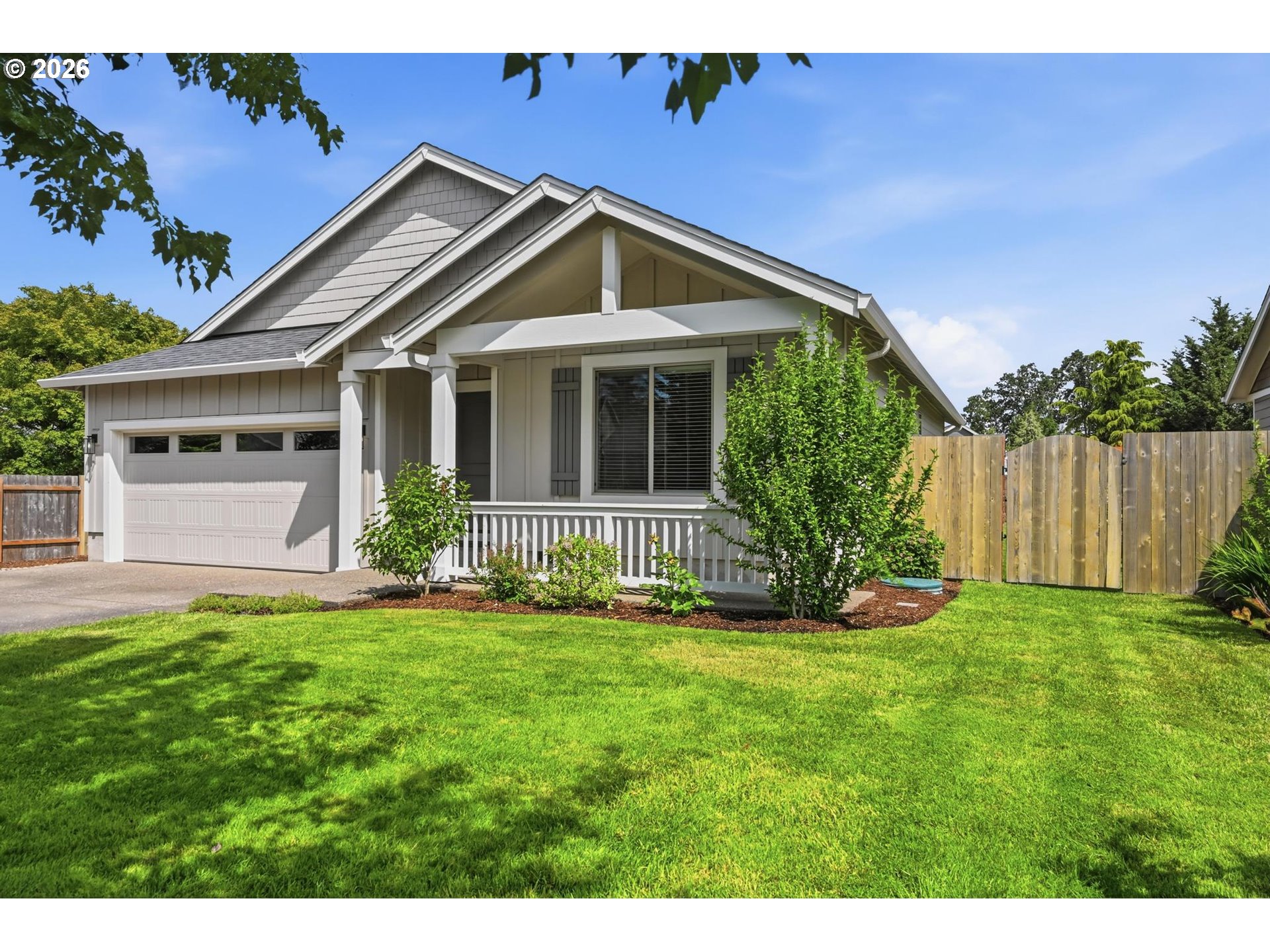 1075 Sage Street Silverton, OR 97381 - Photo 2 of 46 a front view of a house with a yard