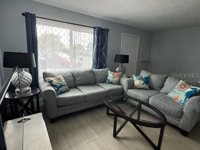 a living room with furniture and a window