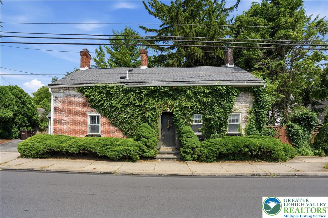 2014 Linden Street Bethlehem, PA 18017 - Photo 2 of 85 A charming exterior with rich green ivy covering the front, complemented by neatly trimmed foundational plantings.