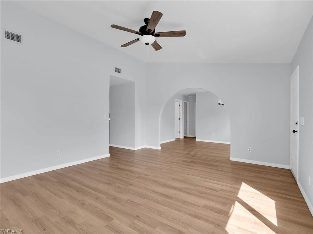 4991 18th Court Southwest Naples, FL 34116 - Photo 10 of 36 a view of empty room with wooden floor
