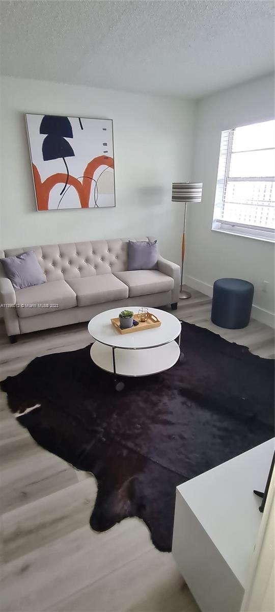 444 Southwest 4th Street, Unit 102 Miami, FL 33130 - Photo 4 of 11 a bathroom with a sink and a mirror