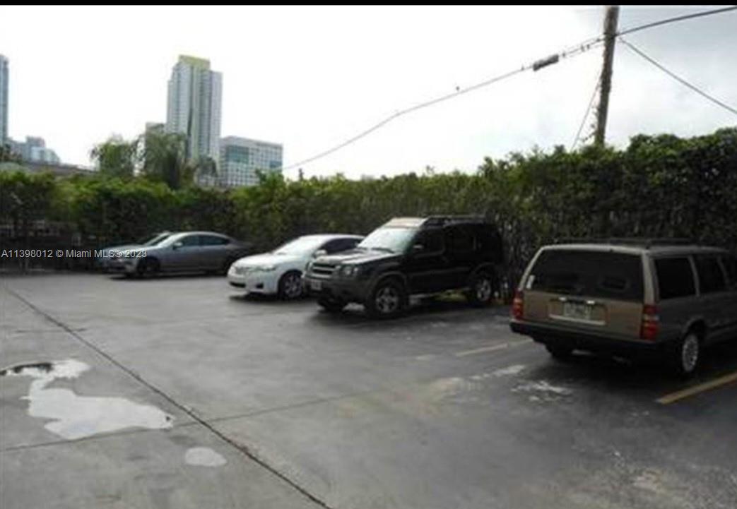 444 Southwest 4th Street, Unit 102 Miami, FL 33130 - Photo 10 of 11 a car parked in front of a house