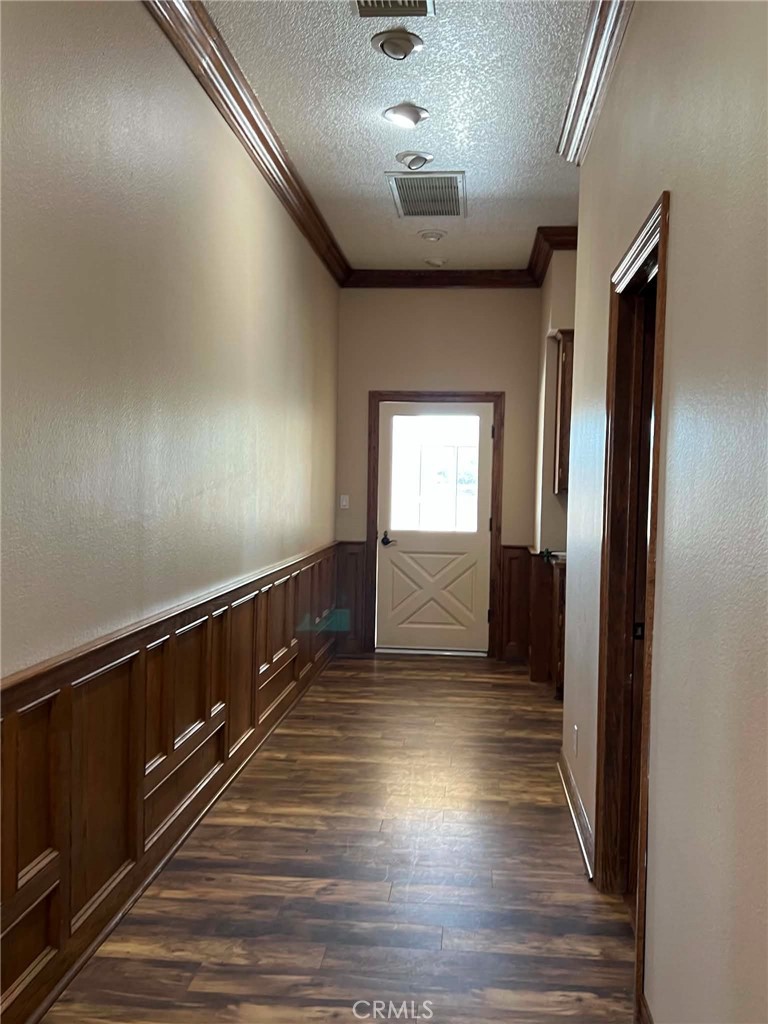 9126 Kittering Road Oak Hills, CA 92344 - Photo 30 of 47 hallway leading to laundry room and outside patio