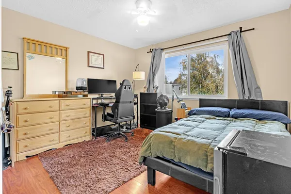 a bed room with a bed and a window