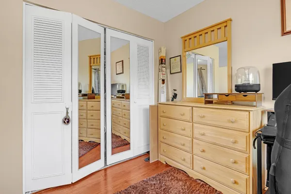 a bathroom with a sink a mirror and a shower