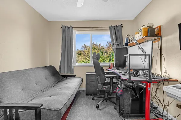 a view of workspace with furniture and window