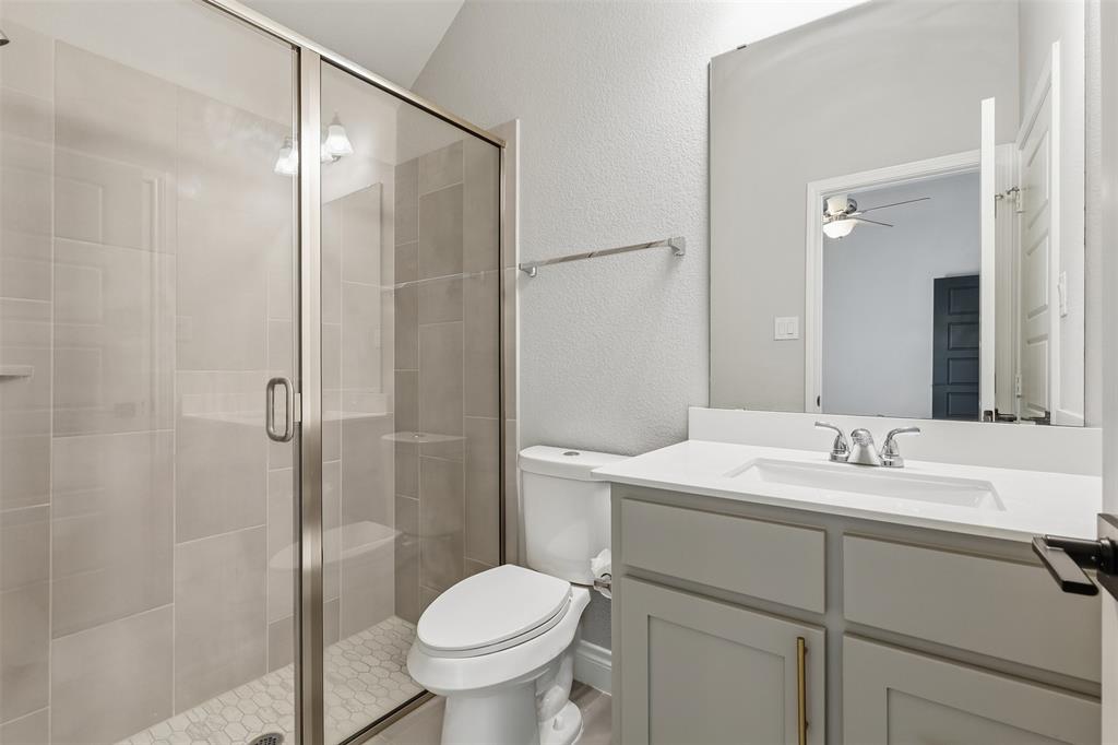 5640 Pradera Road Fort Worth, TX 76126 - Photo 25 of 35 Glass-enclosed shower with subway tile surround and hexagonal tile floor