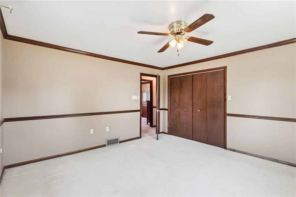948 9th Street New Castle, PA 16101 - Photo 14 of 31 a view of a hallway with a ceiling fan