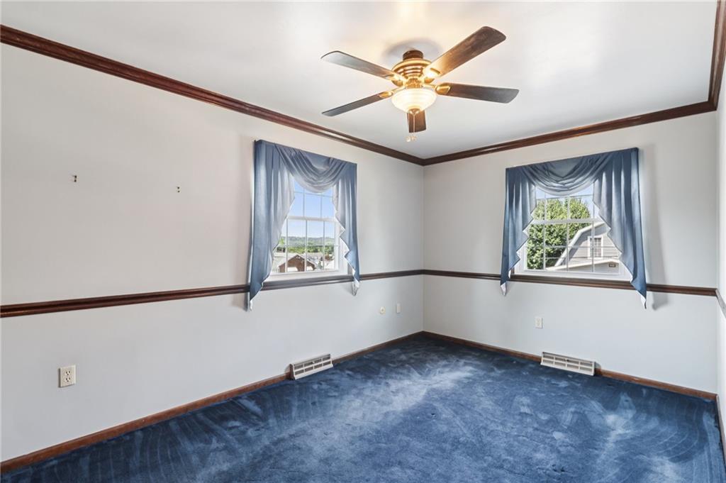 948 9th Street New Castle, PA 16101 - Photo 15 of 31 an empty room with windows and fan
